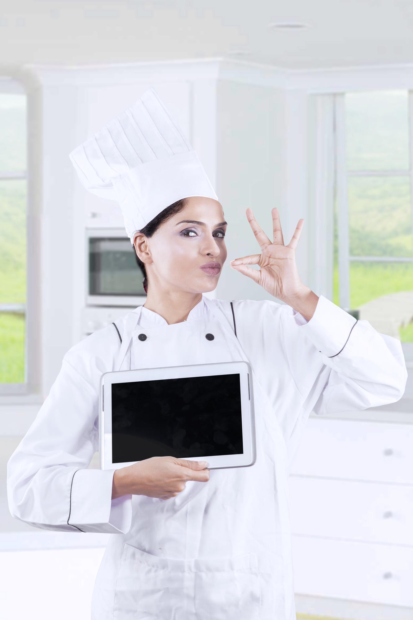 Chef teaching online in modern kitchen with digital overlay